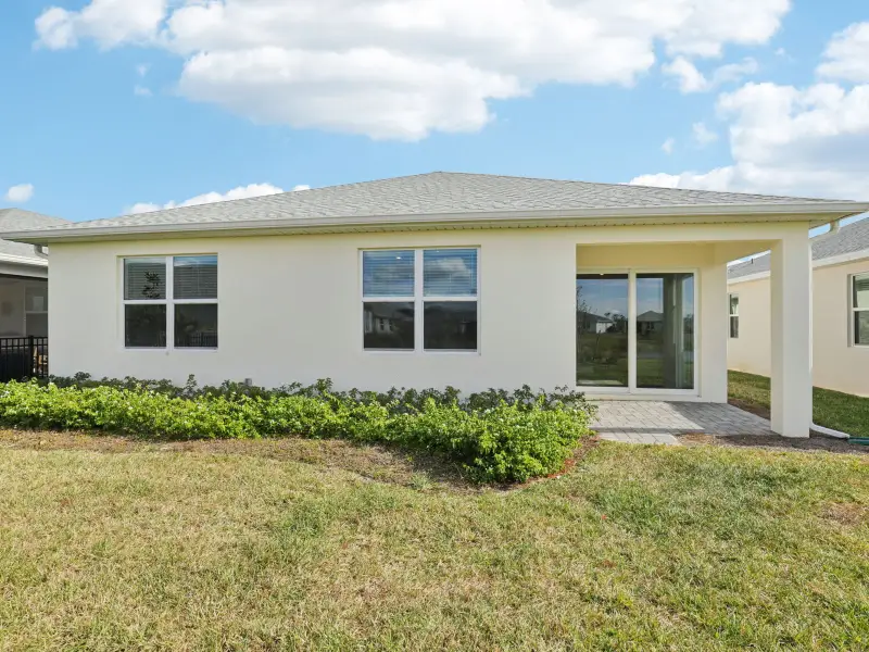 Exterior details and patio area of a home in Crescent Lakes - Reserve Series, Punta Gorda (Image 4).