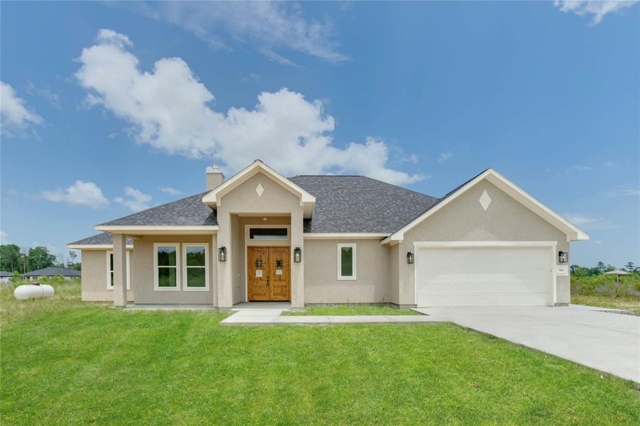 Front exterior of a new home in , Dayton, TX, highlighting curb appeal (Image 4).