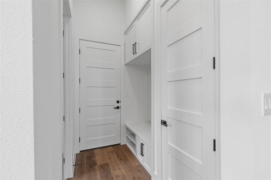 Mudroom with dark wood-type flooring