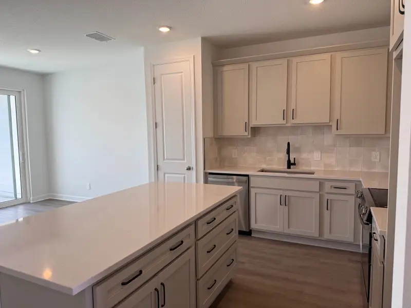 Foyer leads into stunning kitchen, featuring AW Collection® Artisan