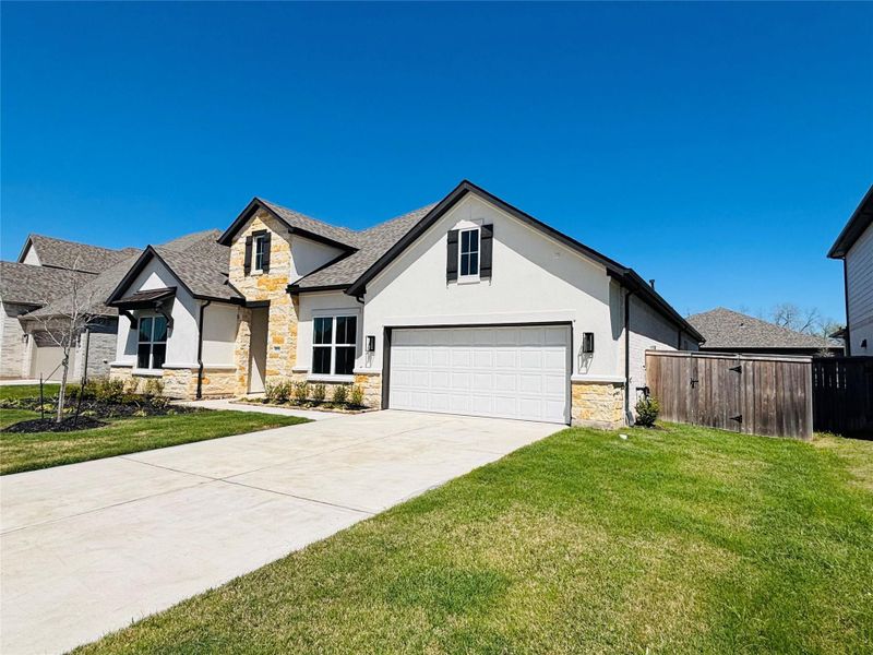 Front exterior of a new home in Fulbrook on Fulshear Creek, Fulshear, TX, highlighting curb appeal (Image 22).