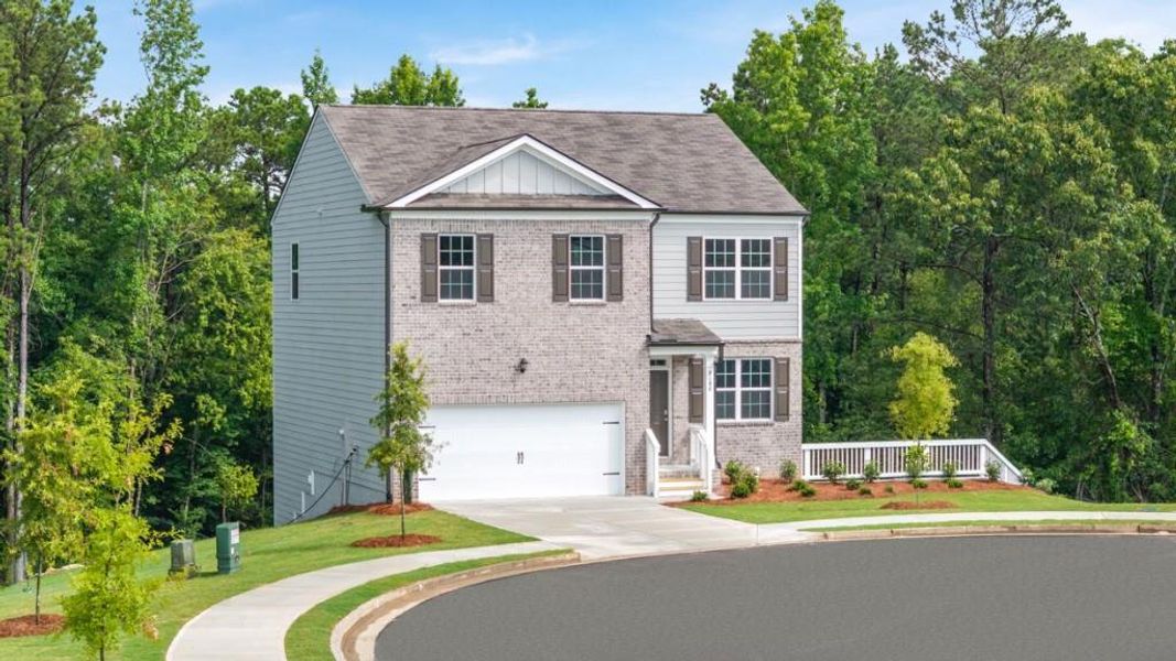 Front exterior of a new home in Oaks at Cedar Grove, Fairburn, GA, highlighting curb appeal (Image 2). Front exterior of a new home in Oaks at Cedar Grove, Fairburn, GA, highlighting curb appeal (Image 2).