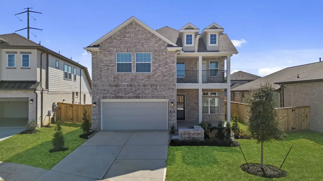 Front exterior of a new home in Bridgeland, Cypress, TX, highlighting curb appeal (Image 2). Front exterior of a new home in Bridgeland, Cypress, TX, highlighting curb appeal (Image 2).