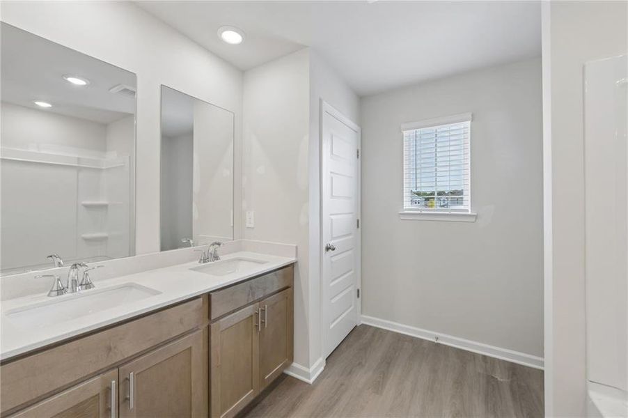 Furnished interior view inside a new home in Martin Springs - Estate Series, Lawrenceville (Image 13).