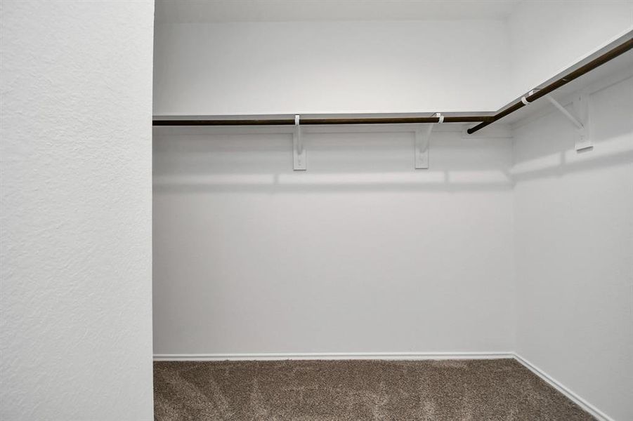 Walk-in closet in the primary bedroom.