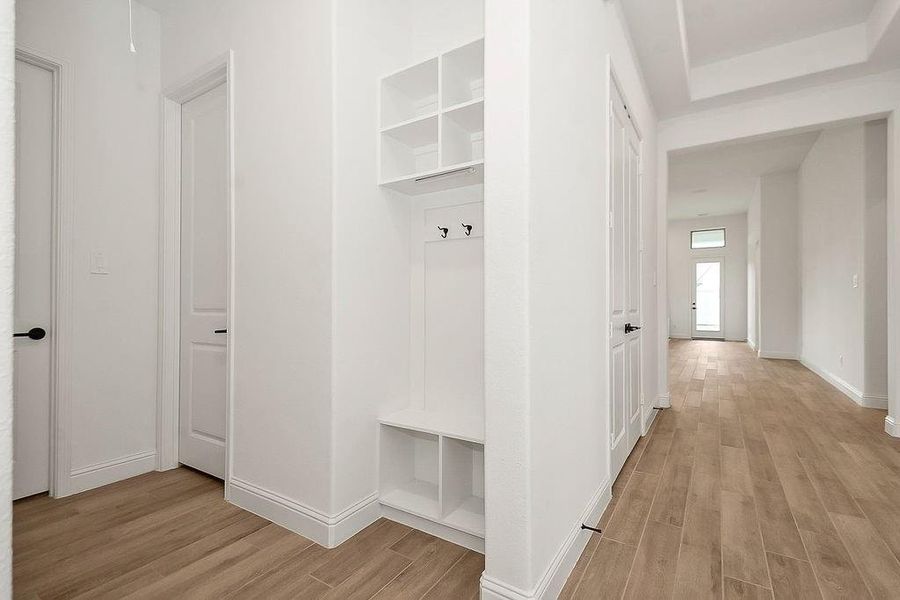 Cubbies and hangars right at the entrance of the home and the garage perfect for storing coats or backpacks and shoes. Cubbies and hangars right at the entrance of the home and the garage perfect for storing coats or backpacks and shoes.