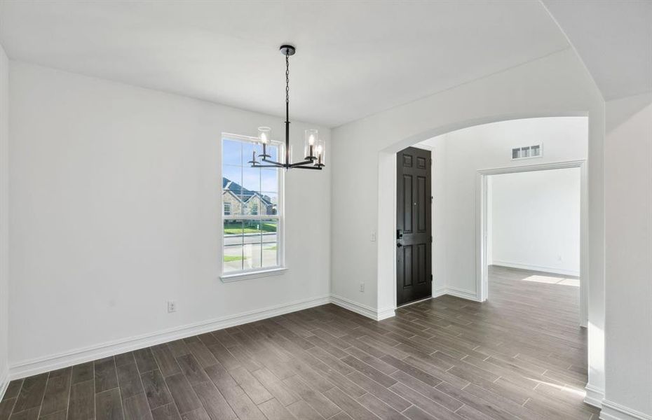 Bright dining room upon entry *real home pictured