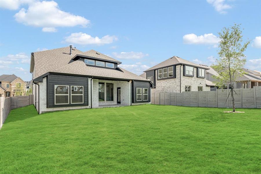 Front exterior of a new home in Painted Tree Woodland District 50, McKinney, TX, highlighting curb appeal (Image 2). Front exterior of a new home in Painted Tree Woodland District 50, McKinney, TX, highlighting curb appeal (Image 2).