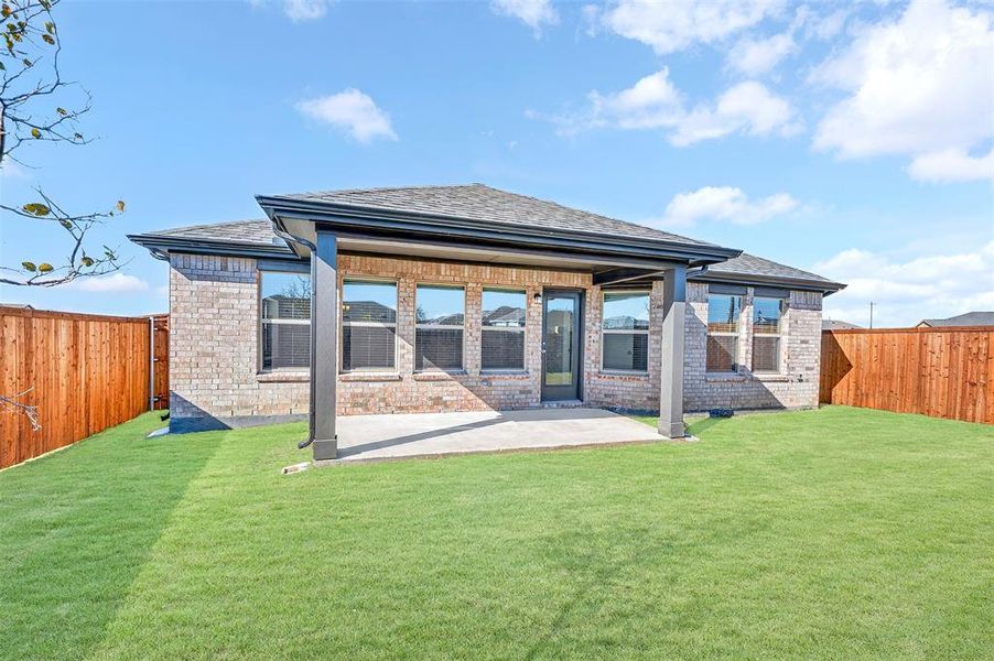 Exterior details and patio area of a home in Mobberly Farms, Pilot Point (Image 4). Exterior details and patio area of a home in Mobberly Farms, Pilot Point (Image 4).