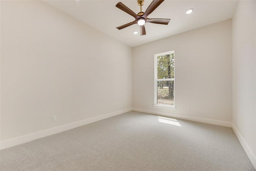 Unfurnished room with carpet flooring, ceiling fan, and recessed lighting