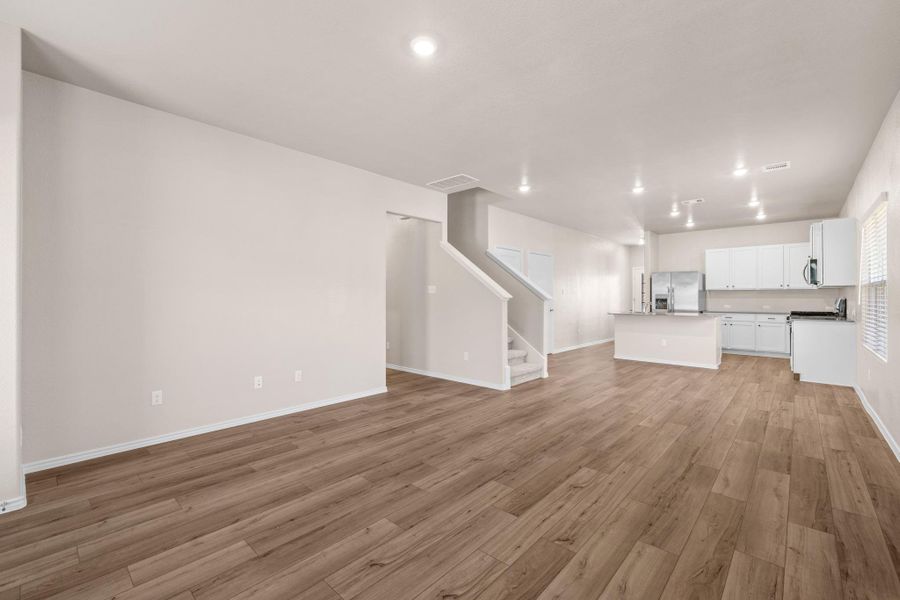 Unfurnished living room with light wood-style flooring and recessed lighting