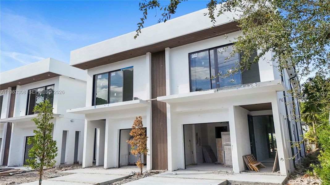 Front exterior of a new home in , Fort Lauderdale, FL, highlighting curb appeal (Image 1). Front exterior of a new home in , Fort Lauderdale, FL, highlighting curb appeal (Image 1).