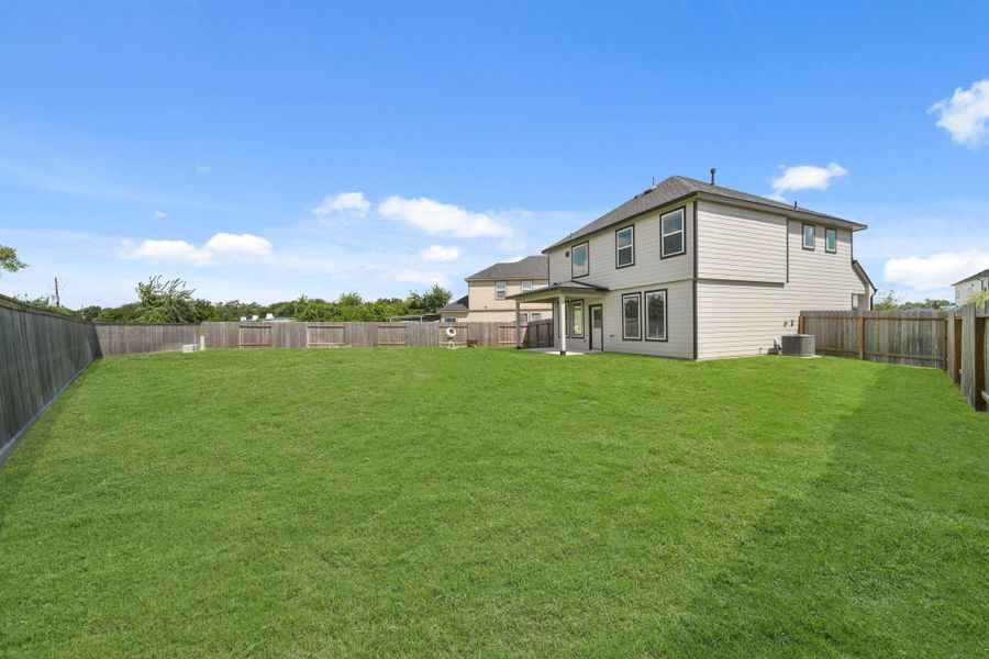 Front exterior of a new home in Grand Oaks Village, Houston, TX, highlighting curb appeal (Image 13). Front exterior of a new home in Grand Oaks Village, Houston, TX, highlighting curb appeal (Image 13).