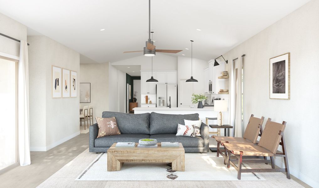 Great room with natural light and ceiling fan