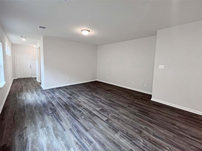 The Mockingbird II- Breakfast Area into Family Room. Sample photo used for illustrative purposes only, options/colors will vary.