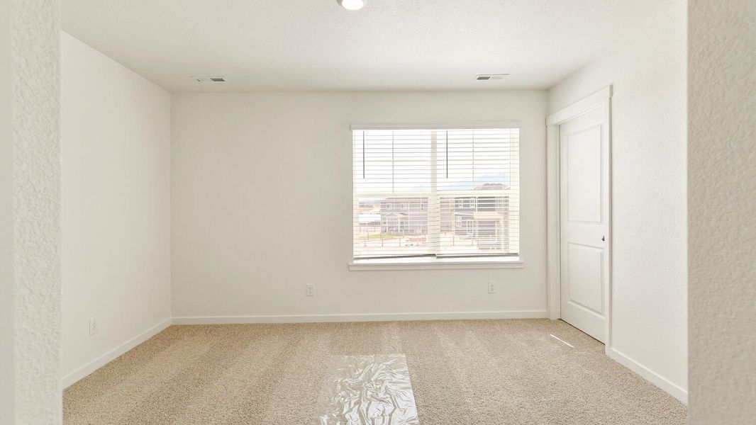 Representative unfurnished interior of a home built from the Lark by D.R. Horton in The Ridge at Lorson Ranch, Colorado Springs (Image 25).