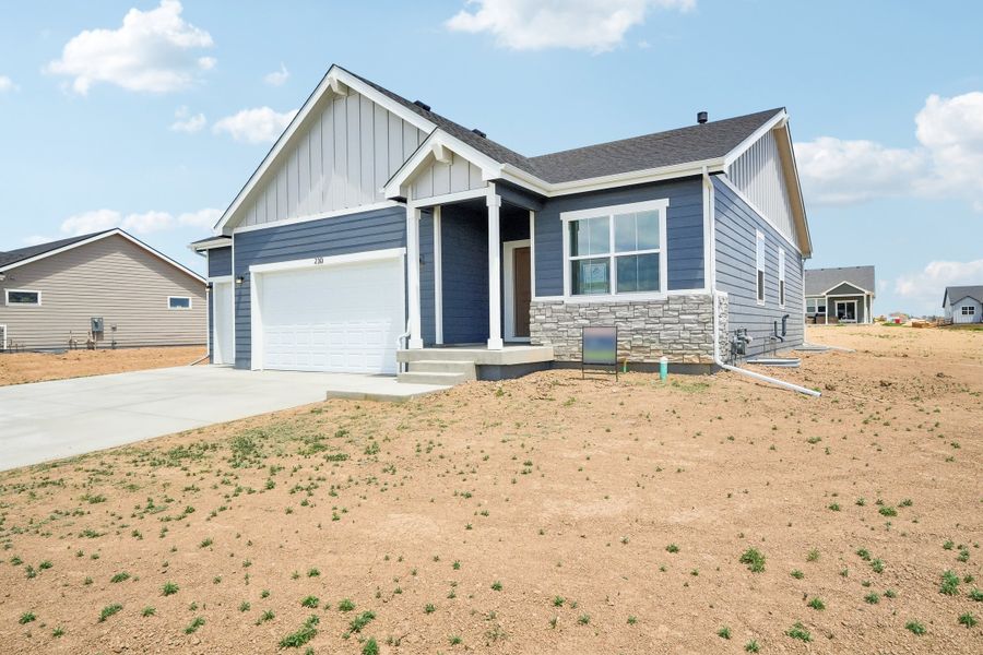 Front exterior of a new home in Hudson Hills, Hudson, CO, highlighting curb appeal (Image 25). Front exterior of a new home in Hudson Hills, Hudson, CO, highlighting curb appeal (Image 25).