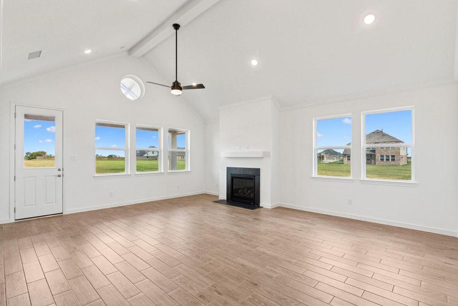 Open great room and dining area with cozy fireplace Open great room and dining area with cozy fireplace