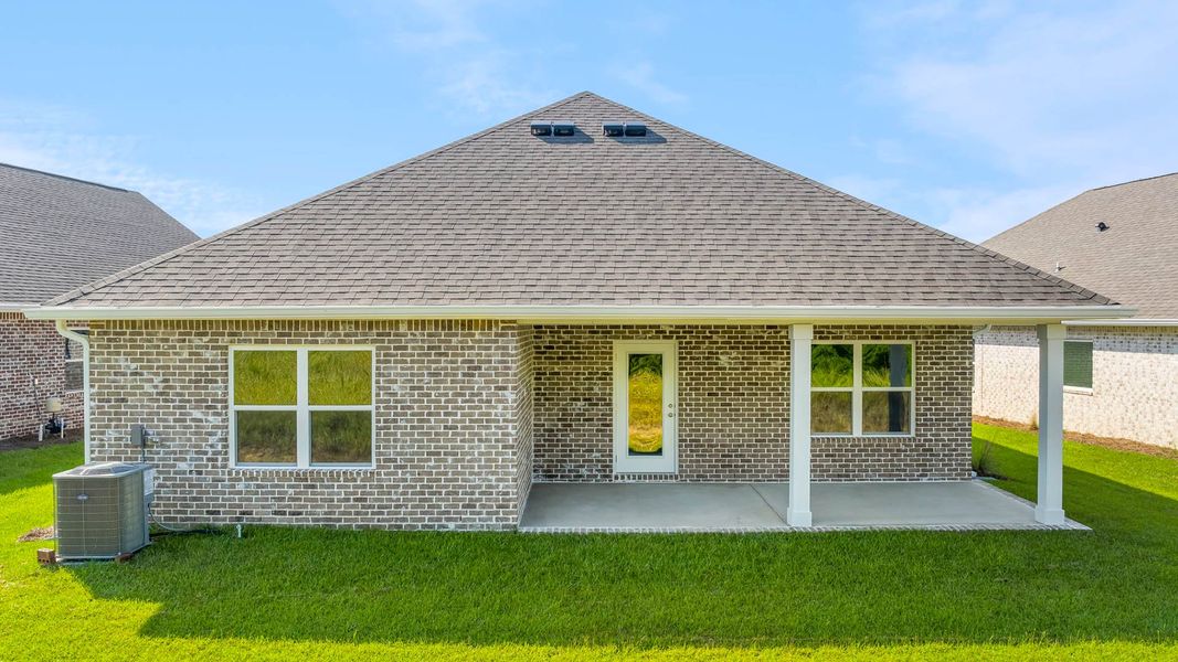 Front exterior of a new home in Owl's Head Farms, Freeport, FL, highlighting curb appeal (Image 16).