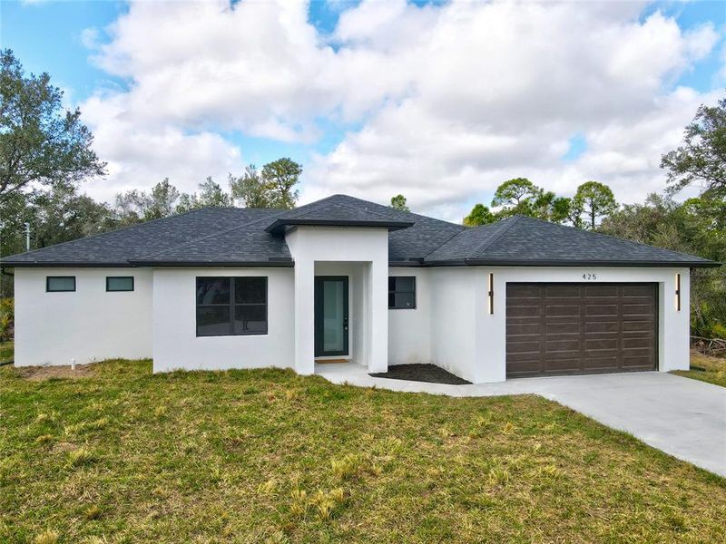 Front exterior of a new home in , Port Charlotte, FL, highlighting curb appeal (Image 26).