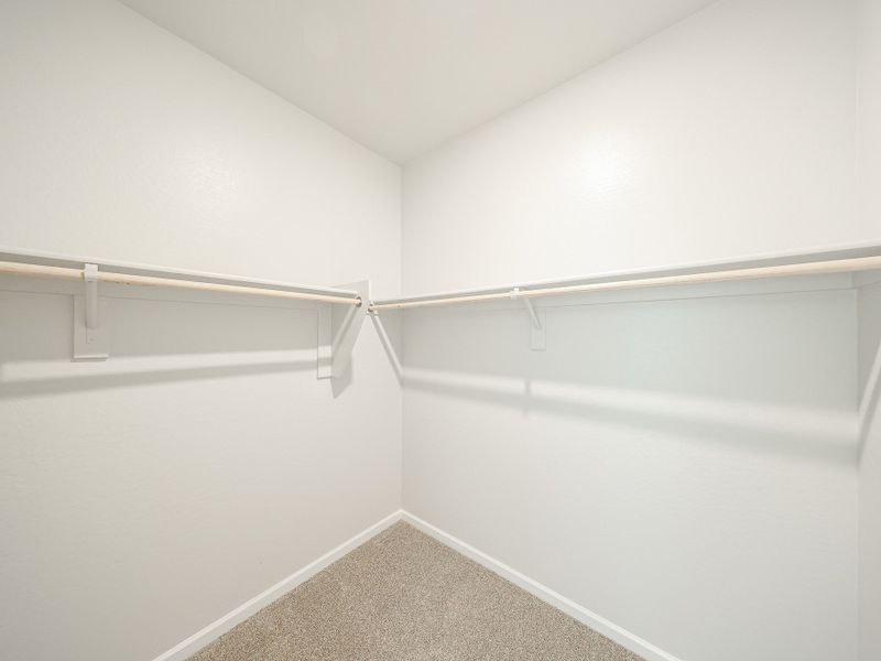 A white wall with a metal bar. A white wall with a metal bar.