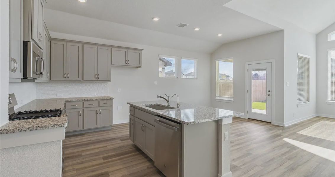 Representative furnished interior of a home built from the Megan by Chesmar Homes in Stream Waters, Buda (Image 4).