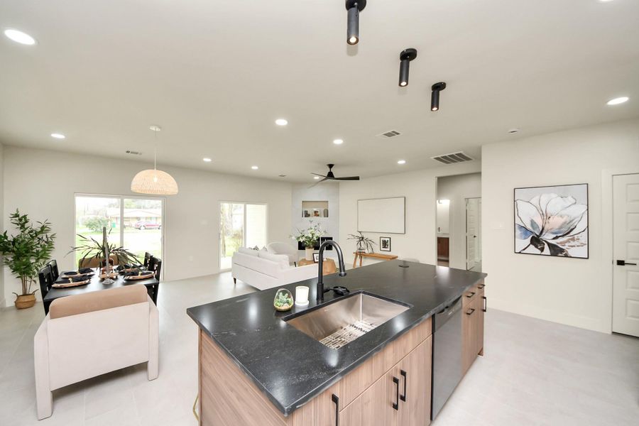 Undermount stainless steel sink paired with a professional-grade pull-down faucet.