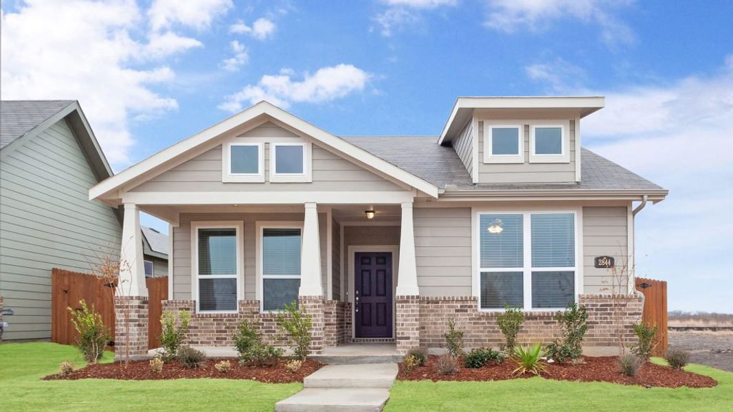 Representative exterior photo of a completed home built from the Joliet by Impression Homes in Heartland, Heartland, TX (Image 1).