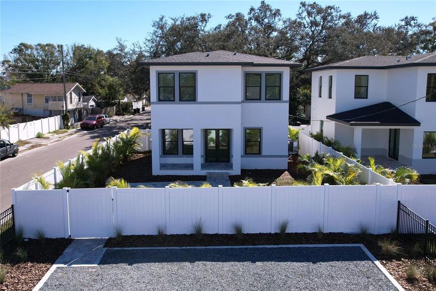Front exterior of a new home in , St. Petersburg, FL, highlighting curb appeal (Image 32).