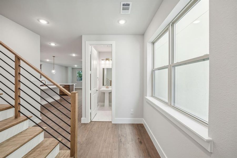 Foyer entrance with light wood-type flooring