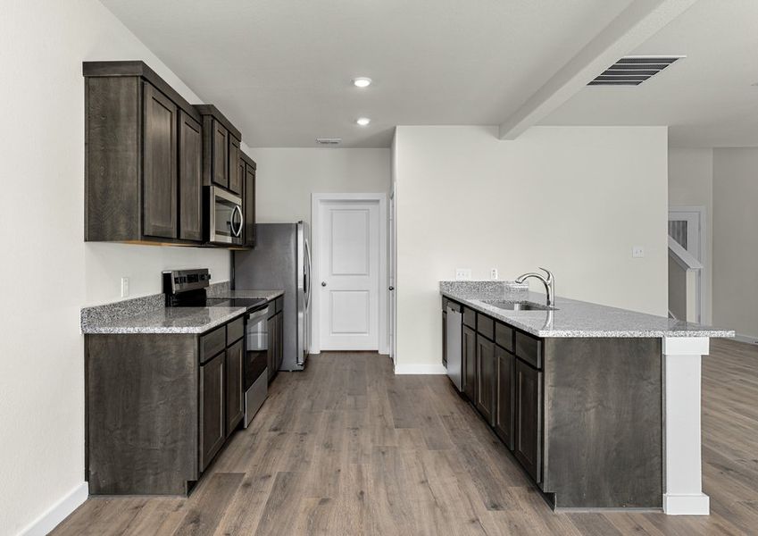 The kitchen has stainless-steel, energy-efficient appliances.
