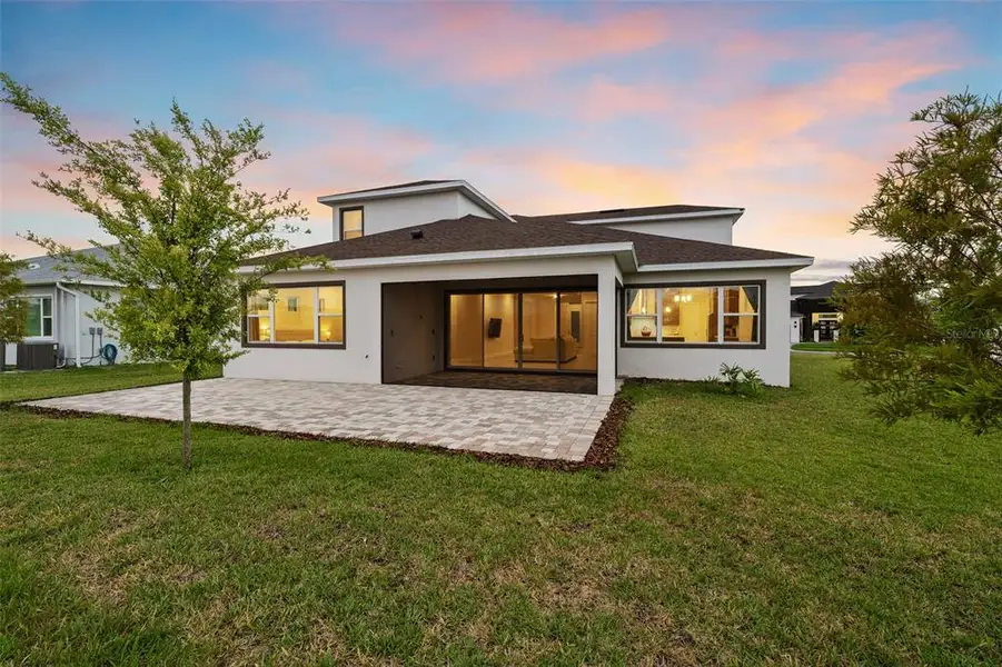 Front exterior of a new home in Robin's Cove at Epperson, Wesley Chapel, FL, highlighting curb appeal (Image 1).