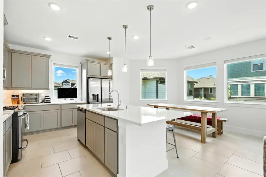 Step into this modern kitchen, wherefunctionality meets sophistication.The focal point is a sleek island thatnot only provides additional counterspace but also serves as a casualgathering spot. Step into this modern kitchen, wherefunctionality meets sophistication.The focal point is a sleek island thatnot only provides additional counterspace but also serves as a casualgathering spot.