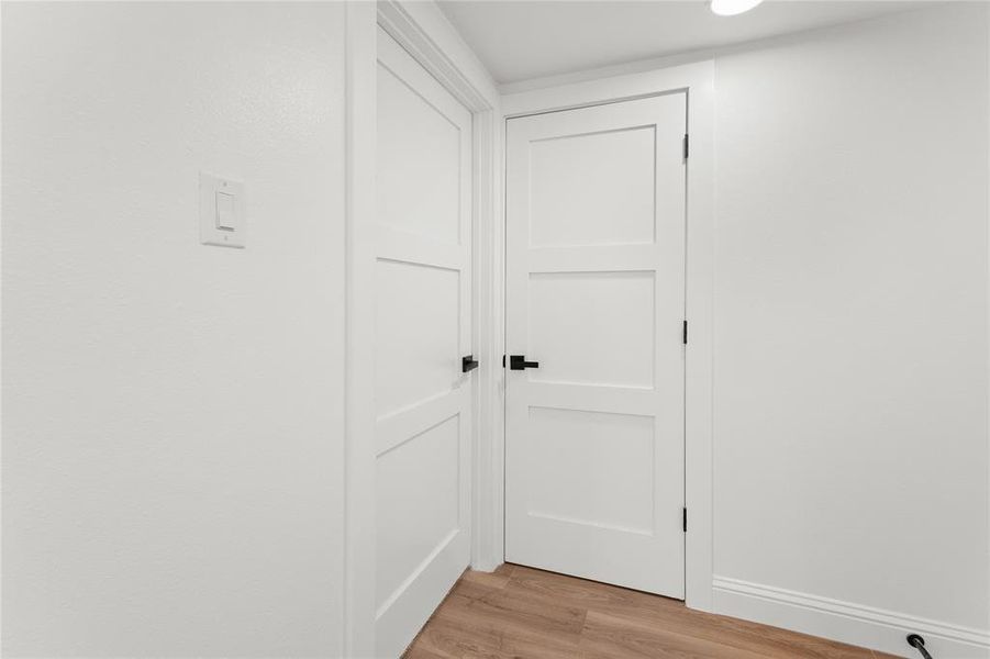 Detailed view of wood finished floors and baseboards