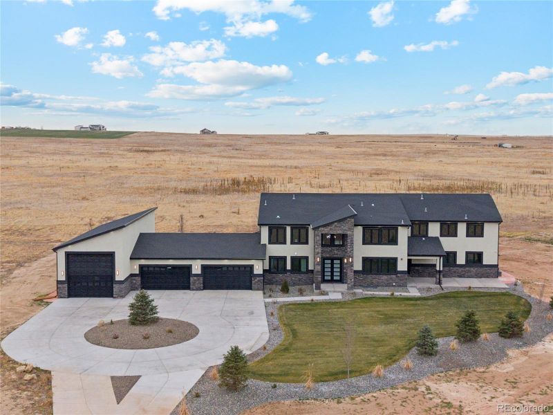Front exterior of a new home in , Hudson, CO, highlighting curb appeal (Image 27).