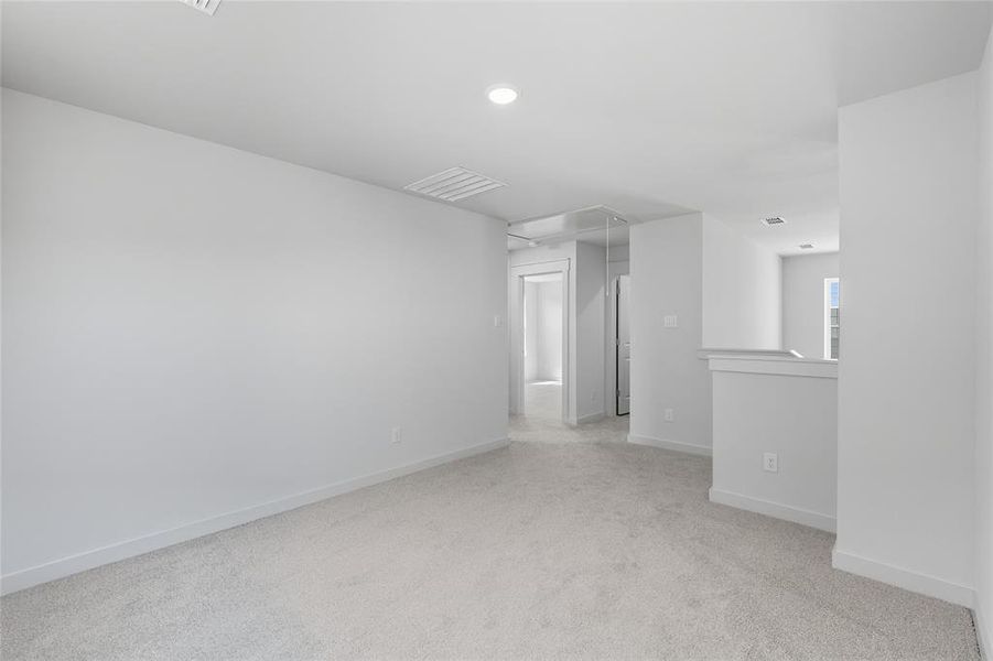 Empty room featuring attic access, light colored carpet, and recessed lighting Empty room featuring attic access, light colored carpet, and recessed lighting