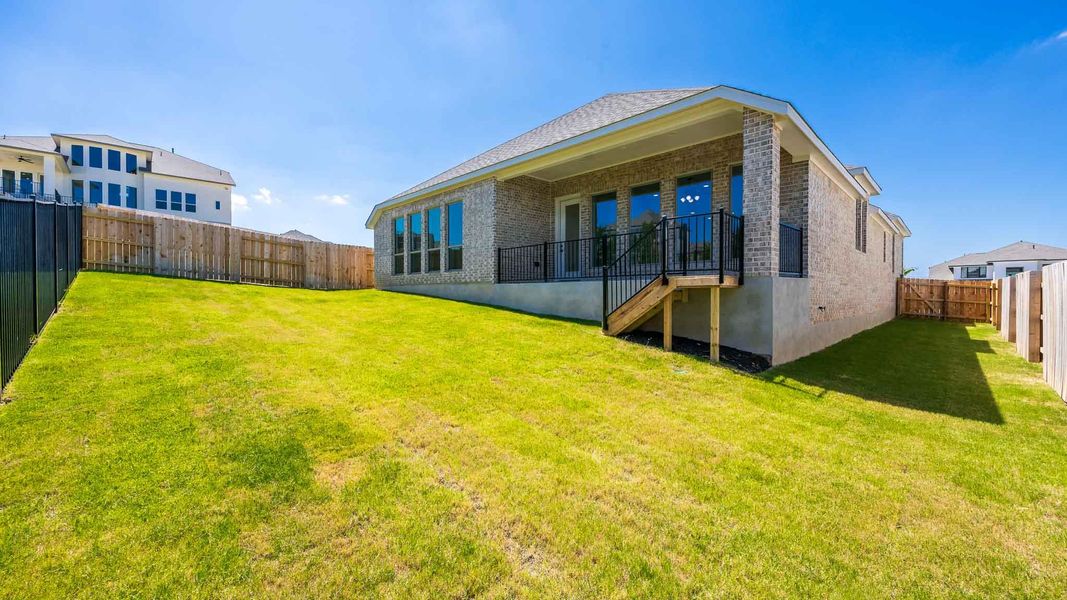 Exterior details and patio area of a home in Lariat 60', Liberty Hill (Image 3).