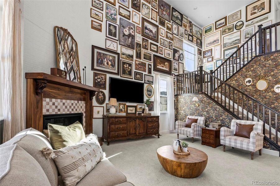 Stunning family room w custom fireplace and photo wall