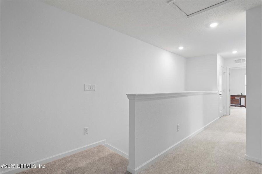 Spacious, unfurnished interior of a new home in Hardwick Farms: Hardwick Farms - Townhome Collection, Jacksonville (Image 19).