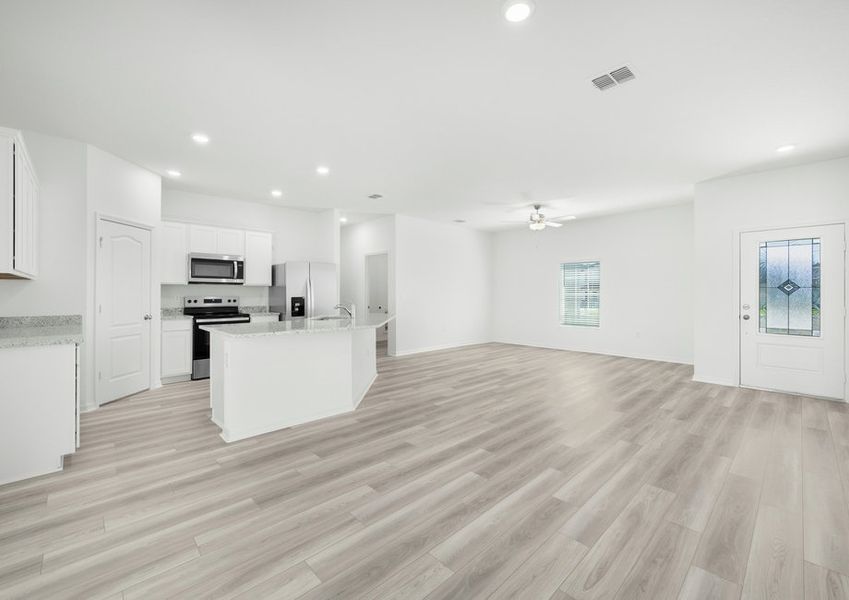The kitchen overlooks the living and dining room The kitchen overlooks the living and dining room
