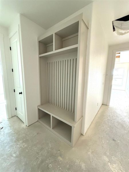 Mudroom featuring concrete flooring Mudroom featuring concrete flooring