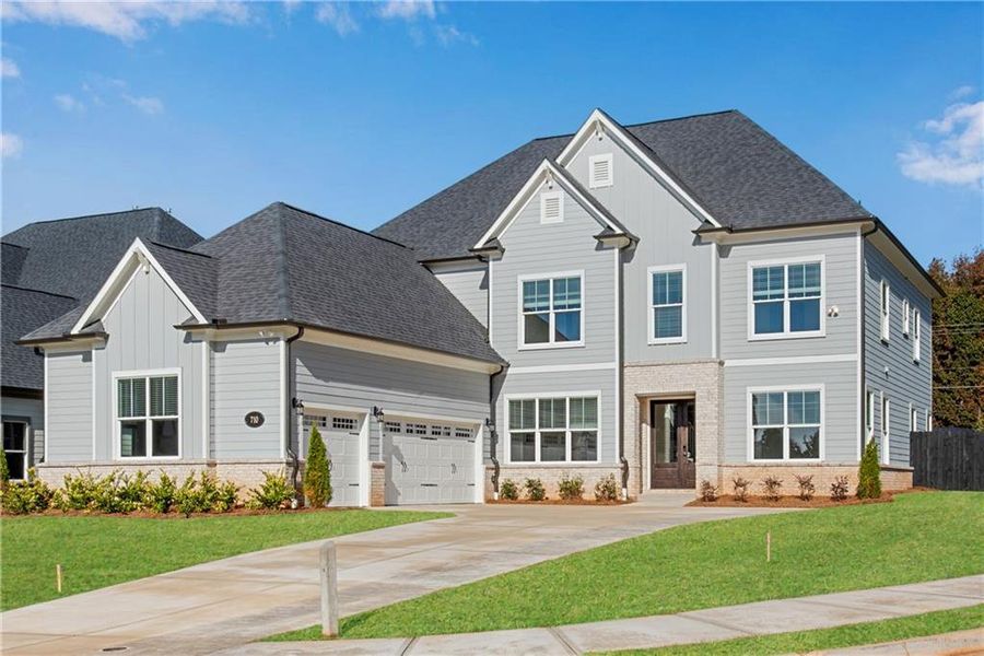 Front exterior of a new home in The Retreat at Caney Creek, Alpharetta, GA, highlighting curb appeal (Image 28).