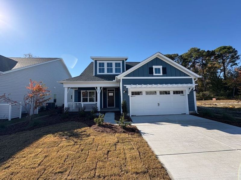 Front exterior of a new home in Riverside Cove, Wilmington, NC, highlighting curb appeal (Image 23).
