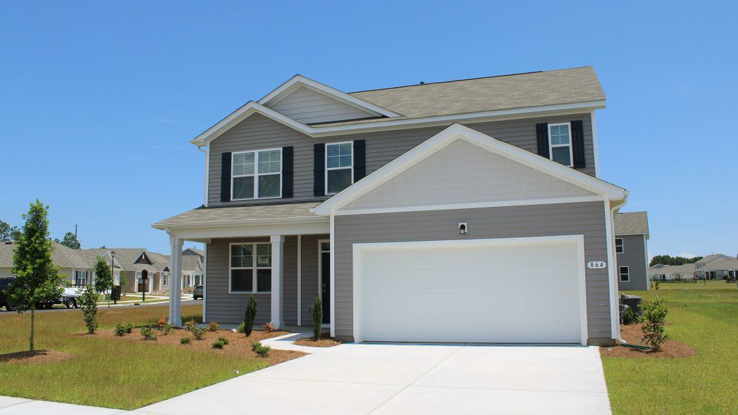 Front exterior of a new home in Eden Springs, Longs, SC, highlighting curb appeal (Image 21). Front exterior of a new home in Eden Springs, Longs, SC, highlighting curb appeal (Image 21).