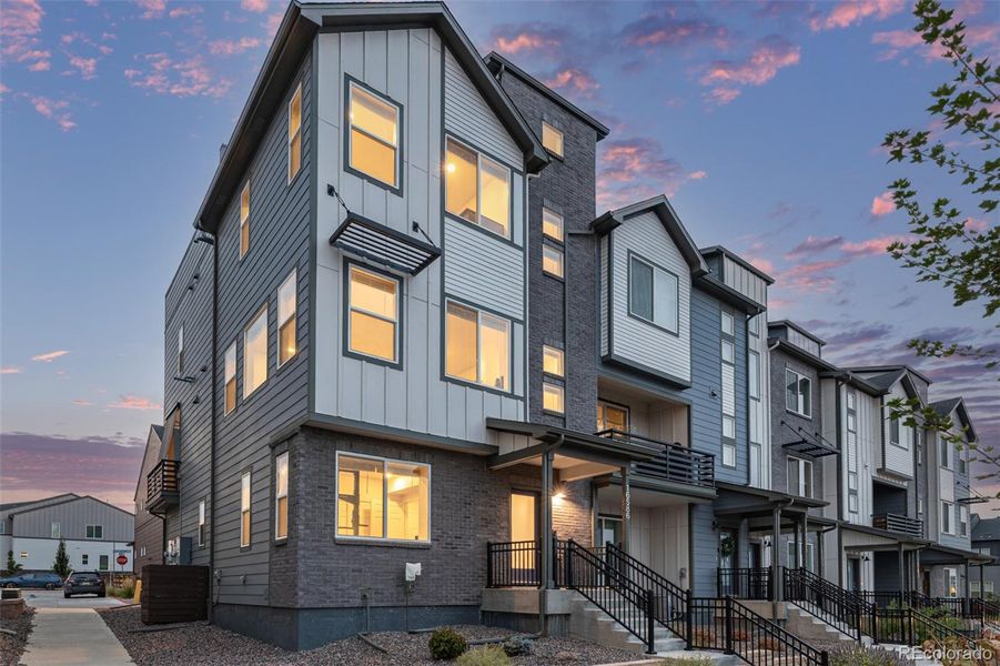 Front exterior of a new home in , Broomfield, CO, highlighting curb appeal (Image 1).