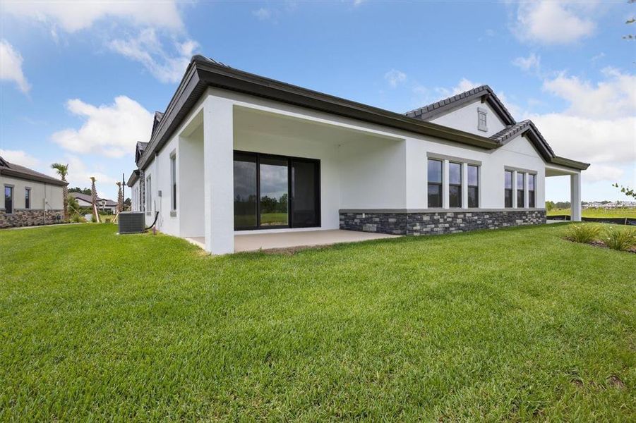 Front exterior of a new home in Two Rivers, Zephyrhills, FL, highlighting curb appeal (Image 17).