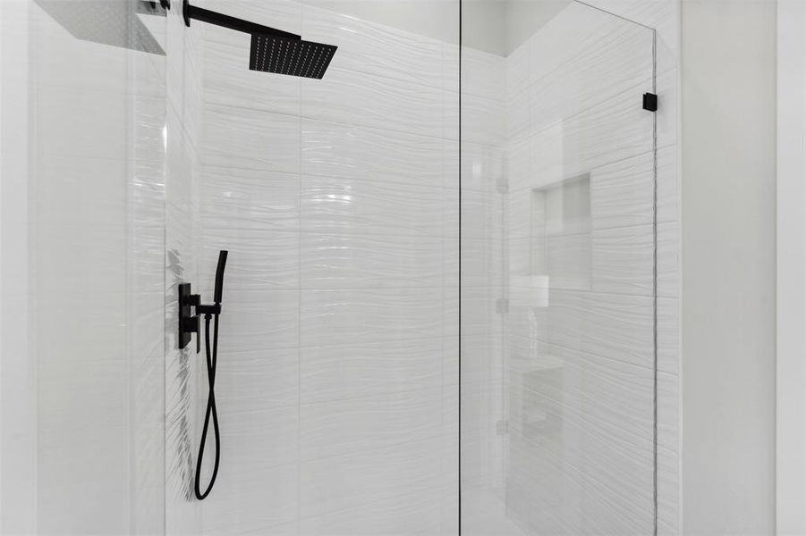 Interior details featuring tiled shower