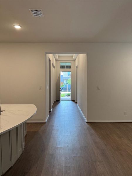 Inviting foyer entry with laminate flooring and high ceilings sets the tone for the open layout. Inviting foyer entry with laminate flooring and high ceilings sets the tone for the open layout.
