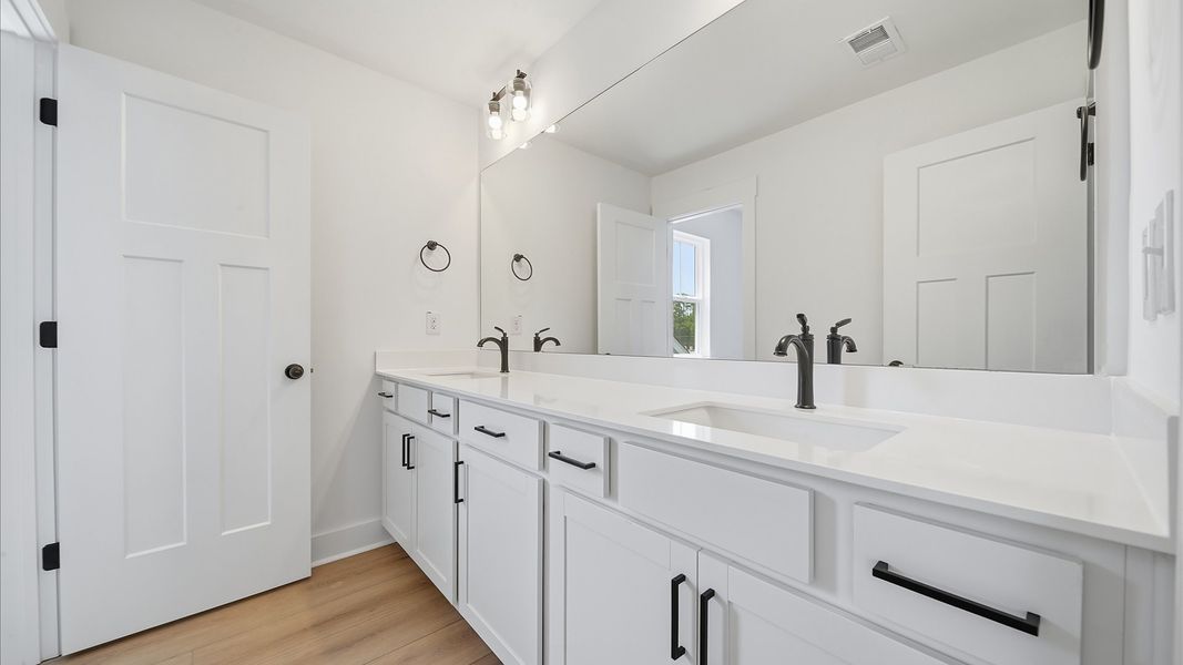 Vibrant and welcoming bathroom with elegant countertop space and polished details Vibrant and welcoming bathroom with elegant countertop space and polished details