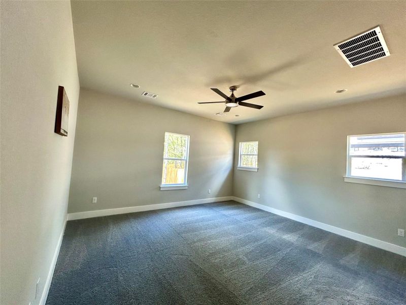 Primary bedroom with recessed lighting. Primary bedroom with recessed lighting.